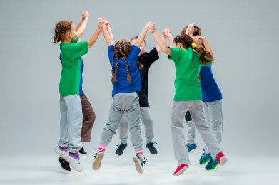 The kids dance school, ballet, hiphop, street, funky and modern dancers on gray studio background